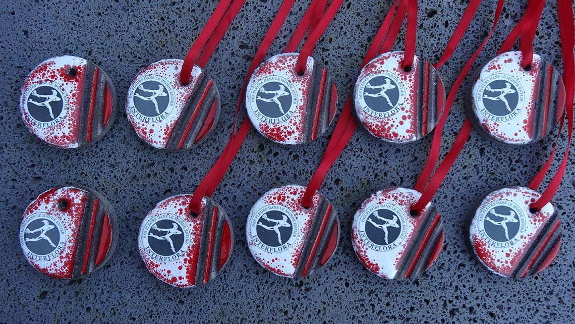 Enamelled lava trophees